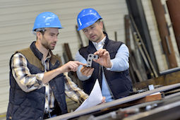 36001350 - engineer with mechanical worker checking on production