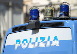 22510172 - gleaming italian police van with flashing lights and